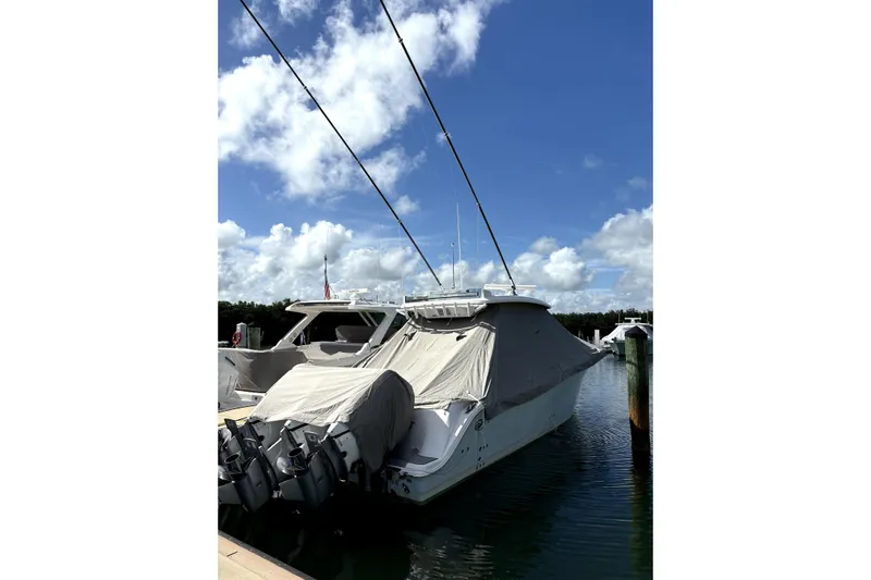  Yacht Photos Pics 2023 Sea Fox 368 Commander boat docked, covered, with clear blue sky background.