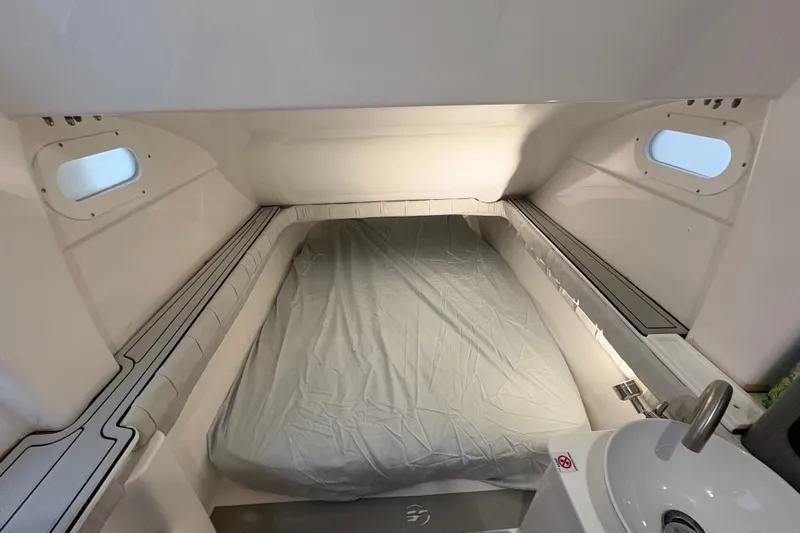 Yacht Photos Pics 2023 Sea Fox 368 Commander cabin interior with bed and portholes.