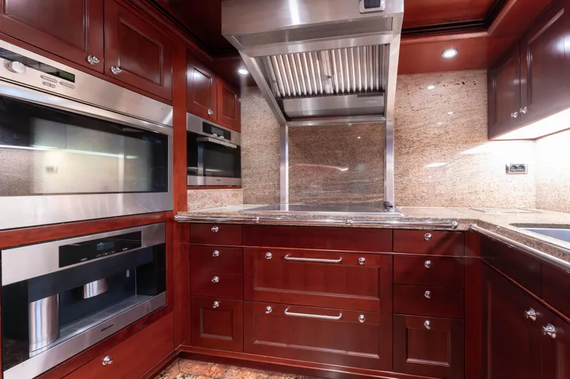 Beothuk Yacht Photos Pics Luxurious yacht kitchen with stainless steel appliances and rich wood cabinetry, 2008 Doggersbank Offshore.