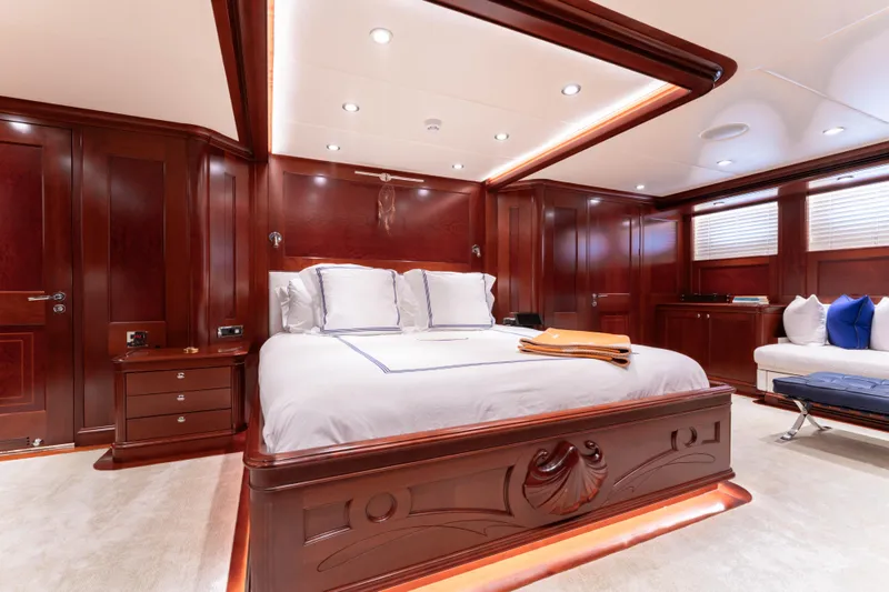 Beothuk Yacht Photos Pics Luxurious yacht bedroom with elegant wood paneling, plush bedding, and ambient lighting, 2008 Doggersbank Offshore.