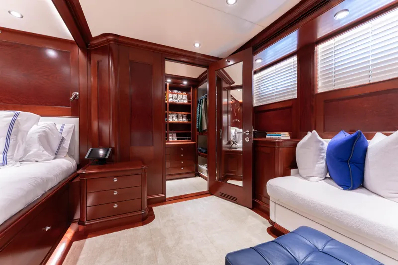 Beothuk Yacht Photos Pics Luxurious yacht cabin interior with wooden finishes, plush seating, and elegant bedding, 2008 Doggersbank Offshore.