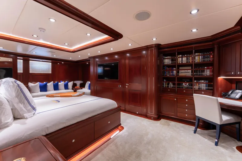 Beothuk Yacht Photos Pics Luxurious yacht interior with elegant wood paneling, cozy seating, and a well-equipped study area.