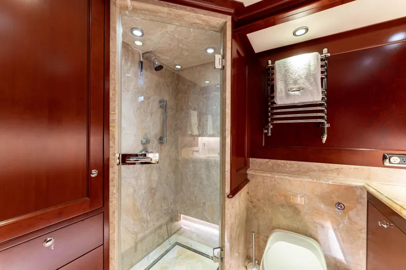 Beothuk Yacht Photos Pics Luxurious yacht bathroom with marble shower, wooden cabinetry, and towel rack, 2008 Kuipers Woudsend Doggersbank Offshore.