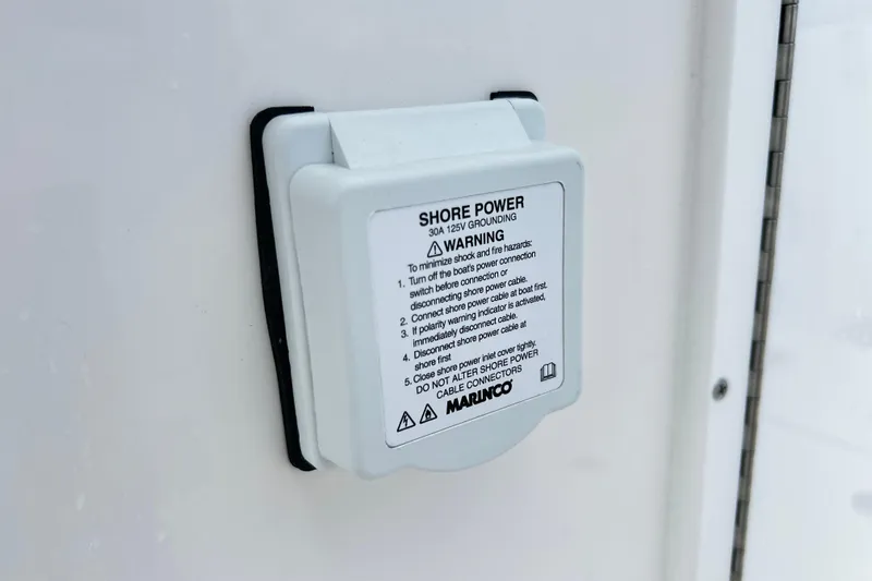  Yacht Photos Pics Shore power outlet on 2026 Sea Fox 328 Commander boat with safety instructions.