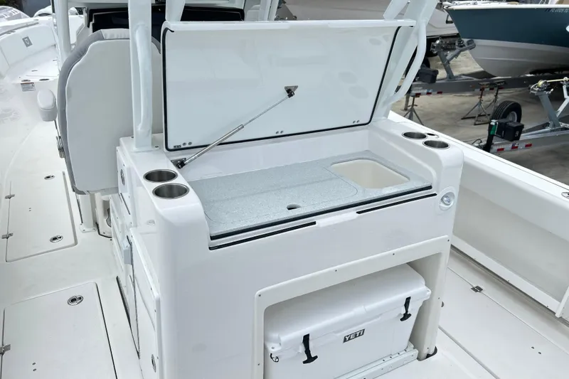  Yacht Photos Pics 2026 Sea Fox 328 Commander boat interior with open storage and cooler.