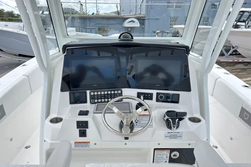  Yacht Photos Pics 2026 Sea Fox 328 Commander helm with dual screens and modern controls.