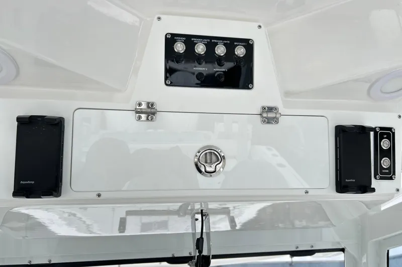  Yacht Photos Pics Control panel of 2026 Sea Fox 328 Commander boat with switches and storage.