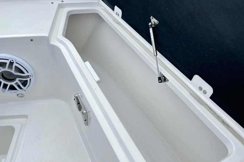  Yacht Photos Pics 2026 Sea Fox 328 Commander storage compartment with speaker and hydraulic lift.