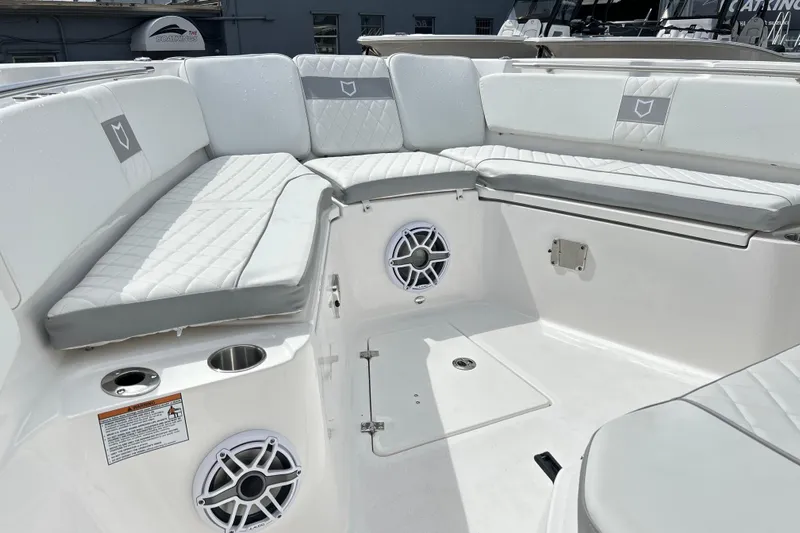  Yacht Photos Pics Interior of 2026 Sea Fox 328 Commander boat with cushioned seating and speakers.