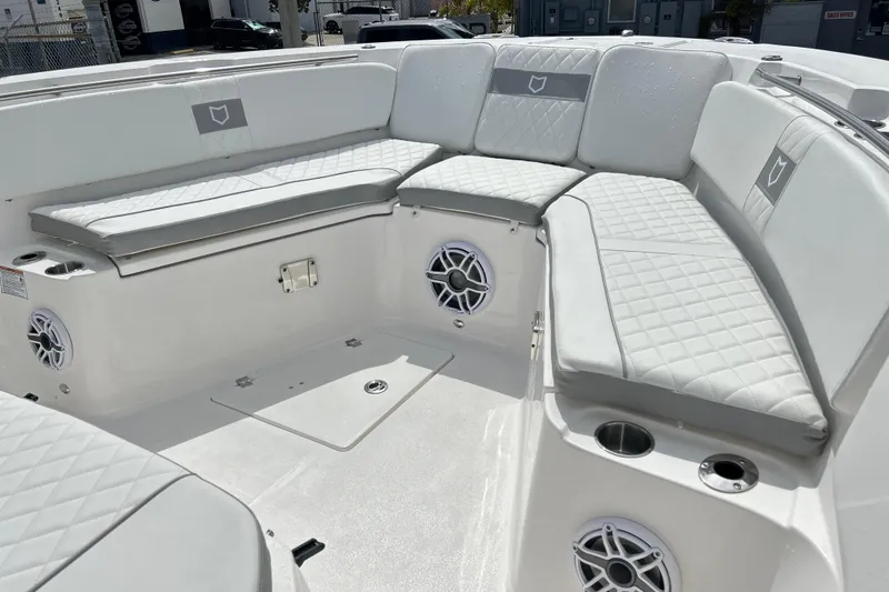  Yacht Photos Pics 2026 Sea Fox 328 Commander boat interior with cushioned seating and built-in speakers.