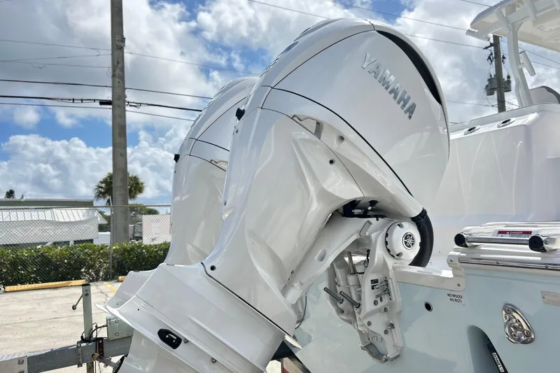  Yacht Photos Pics 2026 Sea Fox 328 Commander with Yamaha outboard engines, parked outdoors under a cloudy sky.