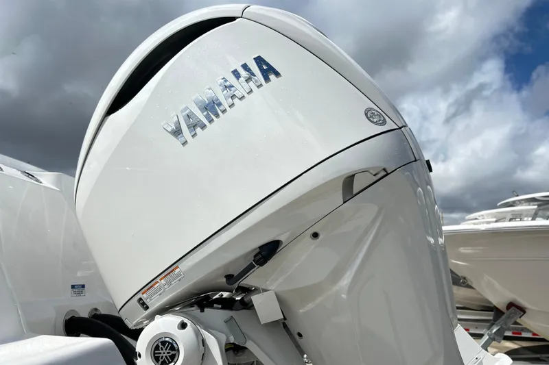  Yacht Photos Pics Yamaha outboard motor on 2026 Sea Fox 328 Commander under cloudy sky.