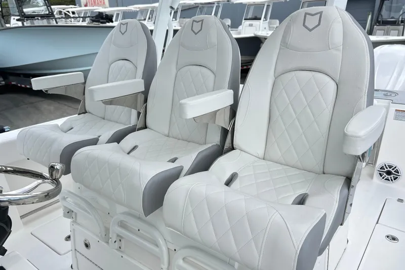  Yacht Photos Pics Luxurious seating on 2026 Sea Fox 328 Commander boat with diamond-stitched upholstery.