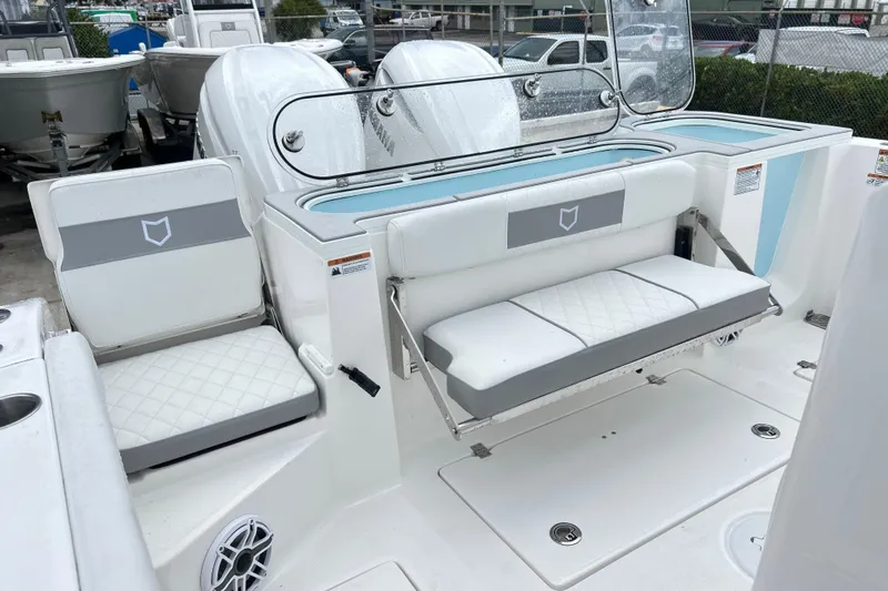  Yacht Photos Pics 2026 Sea Fox 328 Commander boat interior with white seating and storage compartments.