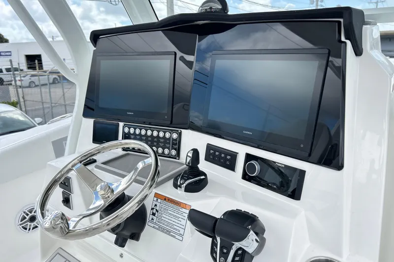  Yacht Photos Pics 2026 Sea Fox 328 Commander helm with dual Garmin displays and modern controls.
