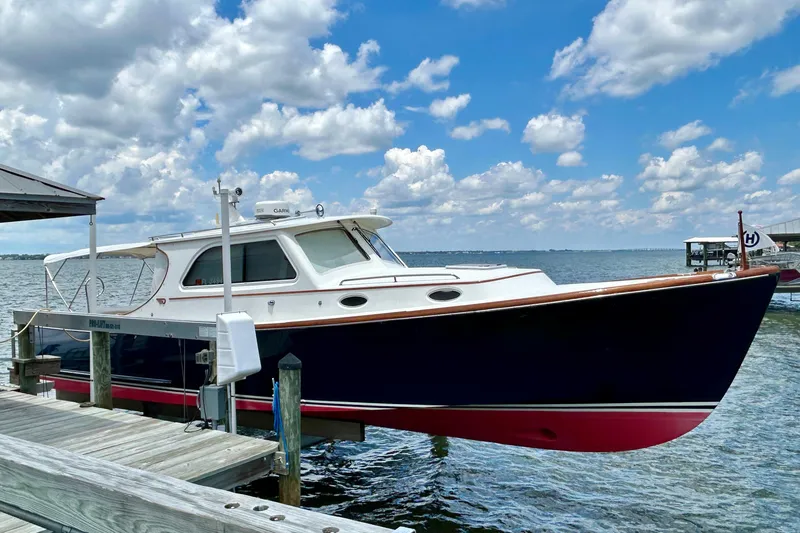 Clarity Yacht Photos Pics 2006 Hinckley 36 EP Picnic Boat docked under a cloudy sky.