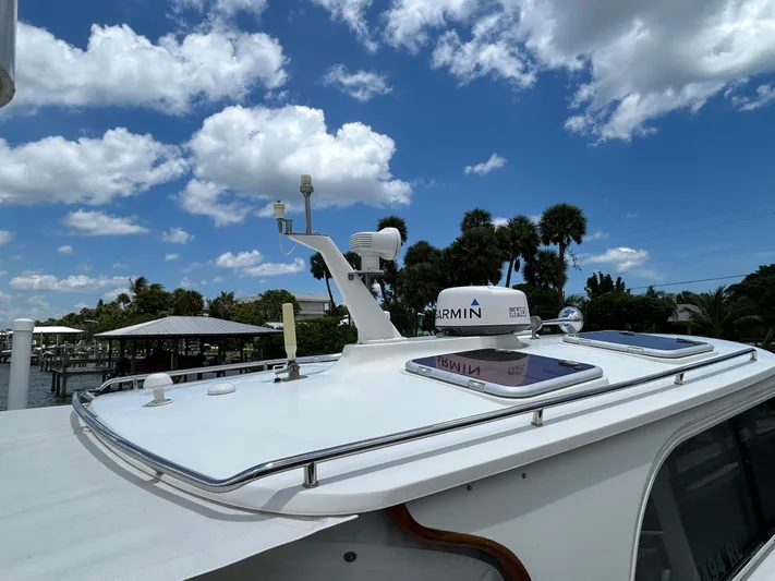Clarity Yacht Photos Pics 2006 Hinckley 36 EP Picnic Boat with Garmin radar under a bright blue sky.