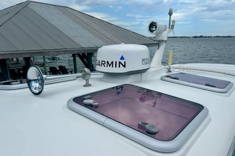 Clarity Yacht Photos Pics 2006 Hinckley 36 EP Picnic Boat with Garmin radar on deck, dockside view.