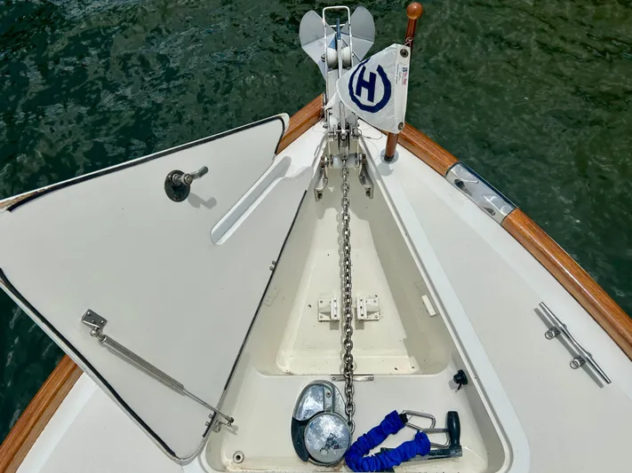 Clarity Yacht Photos Pics Bow of 2006 Hinckley 36 EP Picnic Boat with anchor chain and flag.