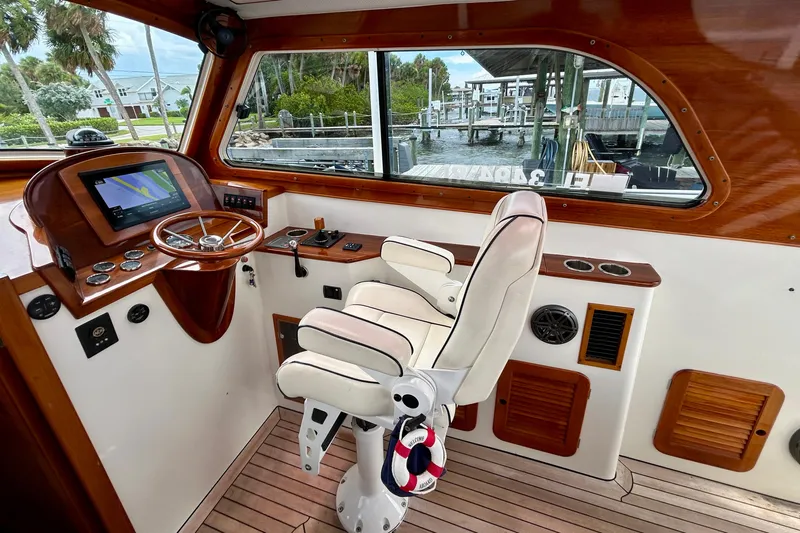 Clarity Yacht Photos Pics Helm of 2006 Hinckley 36 EP Picnic Boat with steering wheel and navigation screen.