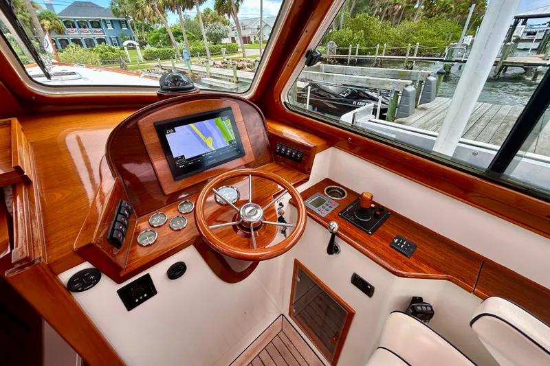 Clarity Yacht Photos Pics 2006 Hinckley 36 EP Picnic Boat helm with wooden dashboard and navigation system.