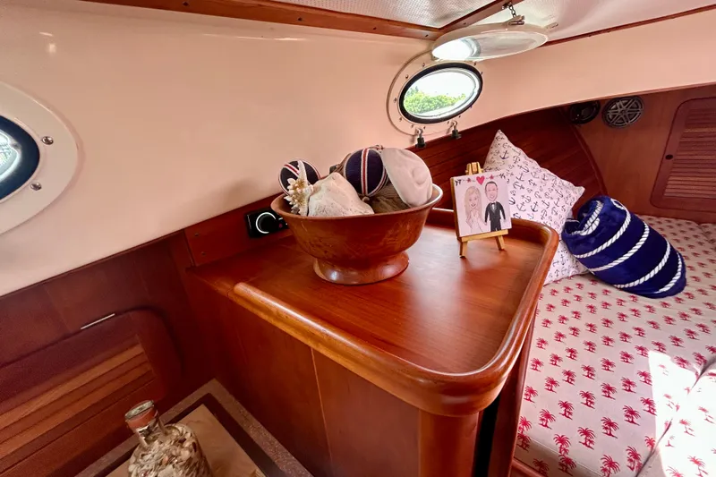 Clarity Yacht Photos Pics Interior of 2006 Hinckley 36 EP Picnic Boat with nautical decor and wooden finish.