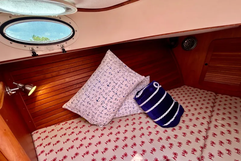 Clarity Yacht Photos Pics Cozy cabin interior of 2006 Hinckley 36 EP Picnic Boat with nautical-themed decor.