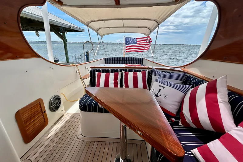 Clarity Yacht Photos Pics 2006 Hinckley 36 EP Picnic Boat interior with striped cushions and American flag.