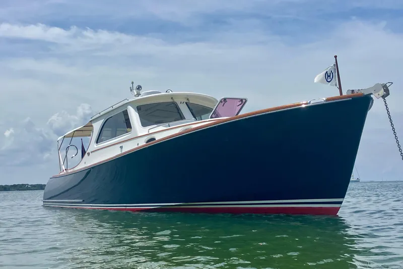 Clarity Yacht Photos Pics 2006 Hinckley 36 EP Picnic Boat on calm water, showcasing elegant design.