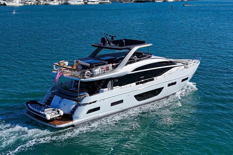  Yacht Photos Pics Luxurious 2022 Princess Y85 yacht cruising on clear blue waters.