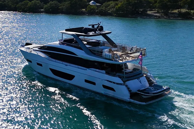  Yacht Photos Pics Luxurious 2022 Princess Y85 yacht cruising on sparkling blue waters.