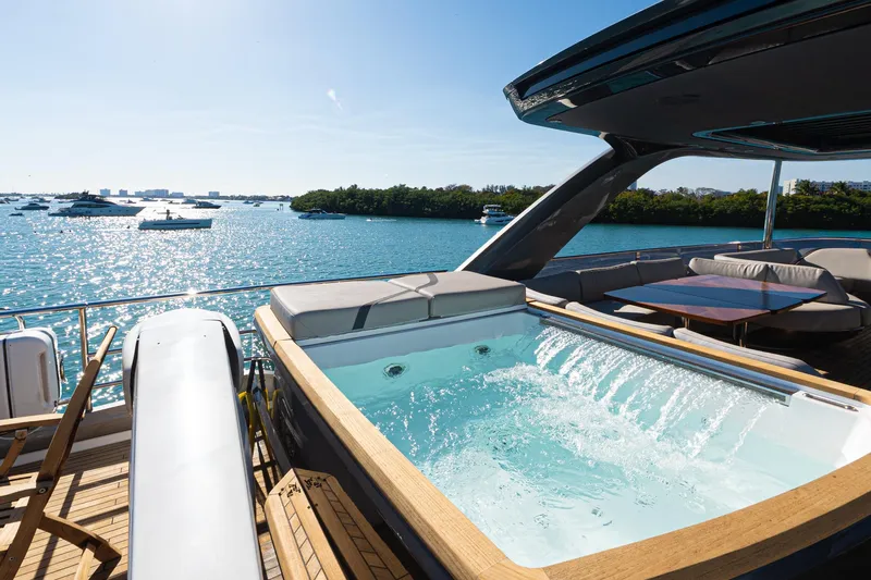  Yacht Photos Pics Luxurious 2022 Princess Y85 yacht with jacuzzi, overlooking a serene ocean view.