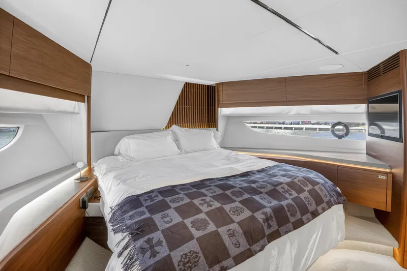  Yacht Photos Pics Luxurious bedroom interior of 2022 Princess Y85 yacht with modern design and elegant furnishings.