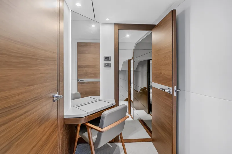  Yacht Photos Pics Luxurious interior of 2022 Princess Y85 yacht with modern wood finishes and elegant design.