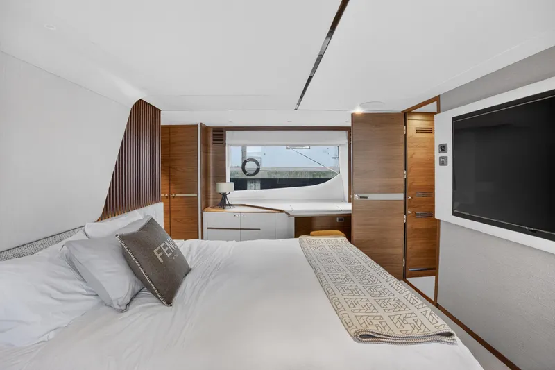  Yacht Photos Pics Luxurious bedroom interior of 2022 Princess Y85 yacht with modern design and elegant furnishings.