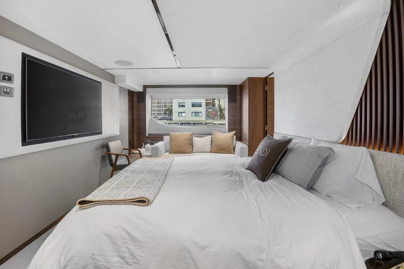  Yacht Photos Pics Luxurious bedroom interior on 2022 Princess Y85 yacht with modern decor and large window view.