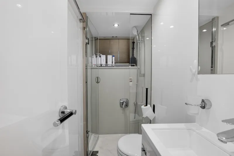  Yacht Photos Pics Luxurious bathroom in 2022 Princess Y85 yacht with modern fixtures and glass shower.