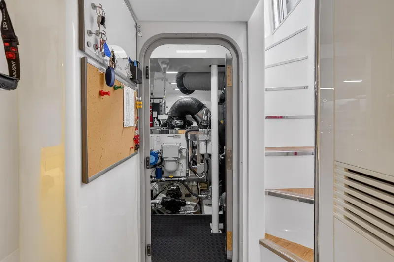  Yacht Photos Pics Engine room entrance of 2022 Princess Y85 yacht, featuring control panels and equipment.