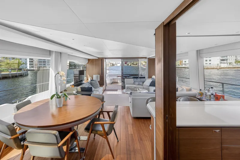  Yacht Photos Pics Luxurious interior of 2022 Princess Y85 yacht with elegant dining and seating areas.