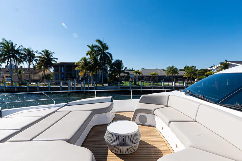  Yacht Photos Pics Luxurious 2022 Princess Y85 yacht deck with elegant seating and waterfront view.