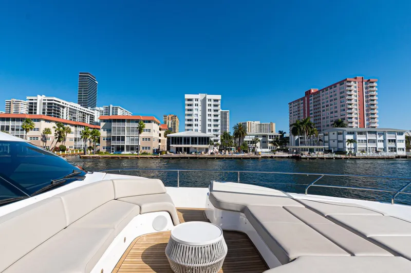  Yacht Photos Pics Luxurious 2022 Princess Y85 yacht with city skyline and waterfront view.