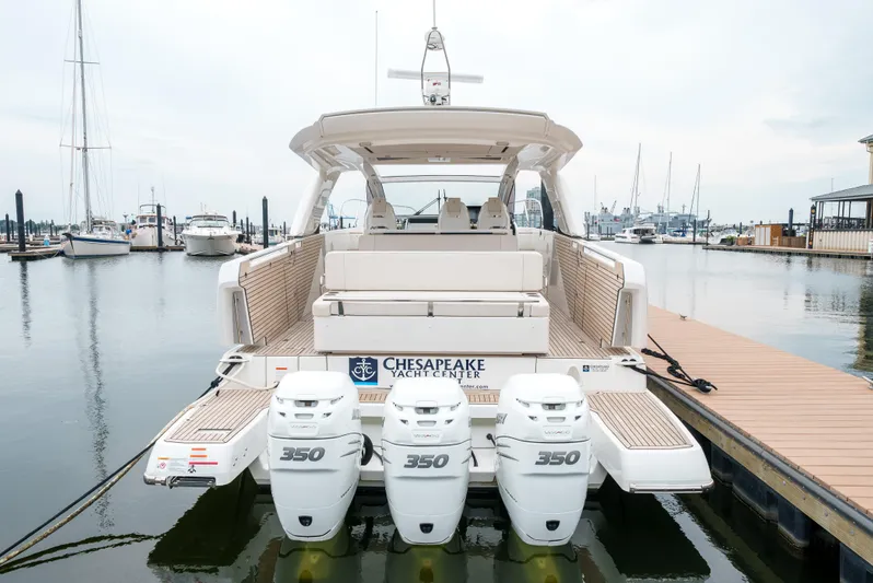  Yacht Photos Pics 2024 Jeanneau DB43 Outboard boat with triple 350 engines at marina dock.