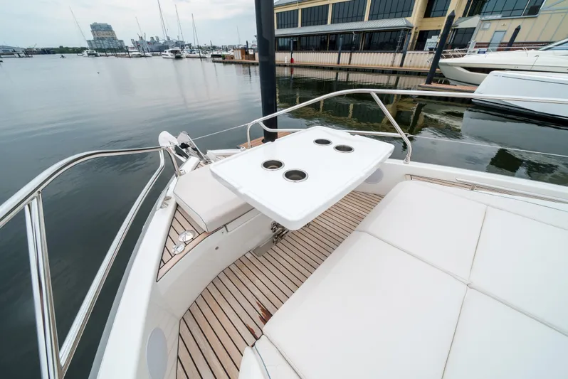  Yacht Photos Pics 2024 Jeanneau DB43 Outboard boat with sleek deck and seating area by the marina.