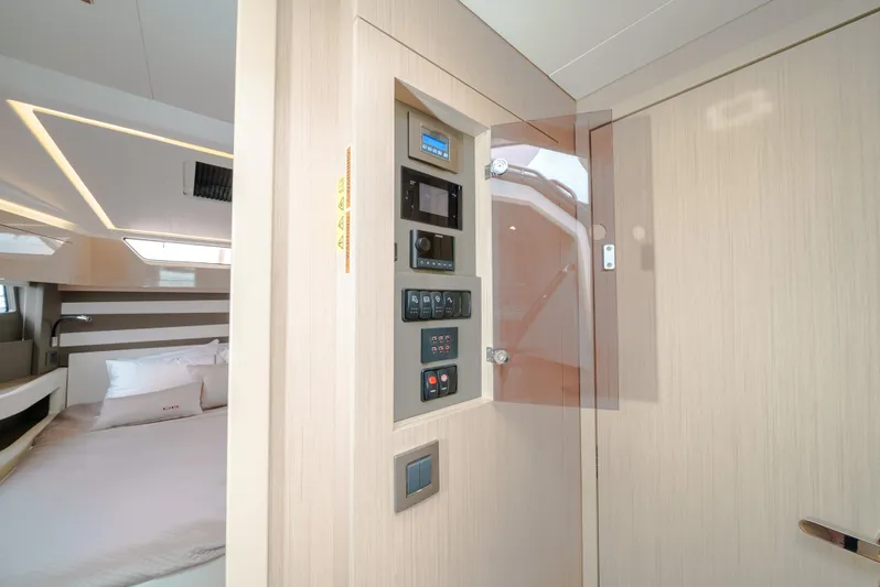  Yacht Photos Pics 2024 Jeanneau DB43 Outboard interior with control panel and modern cabin design.