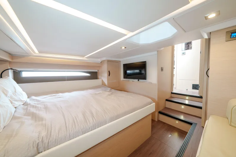  Yacht Photos Pics Luxurious cabin interior of 2024 Jeanneau DB43 Outboard yacht with modern amenities.