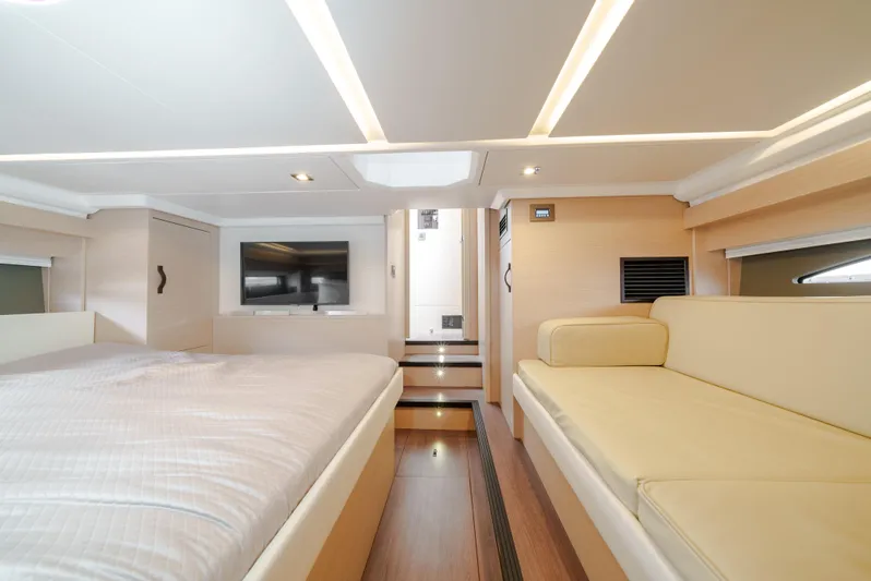  Yacht Photos Pics Luxurious interior of 2024 Jeanneau DB43 Outboard with modern furnishings and ambient lighting.