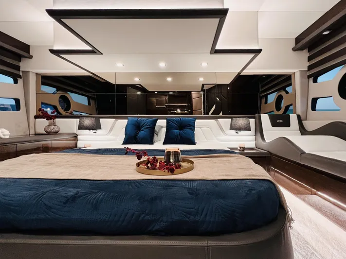 Custom Order Yours Today! Yacht Photos Pics Luxurious interior of 2026 Cobrey 52 Hardtop yacht with elegant bedding and modern design.