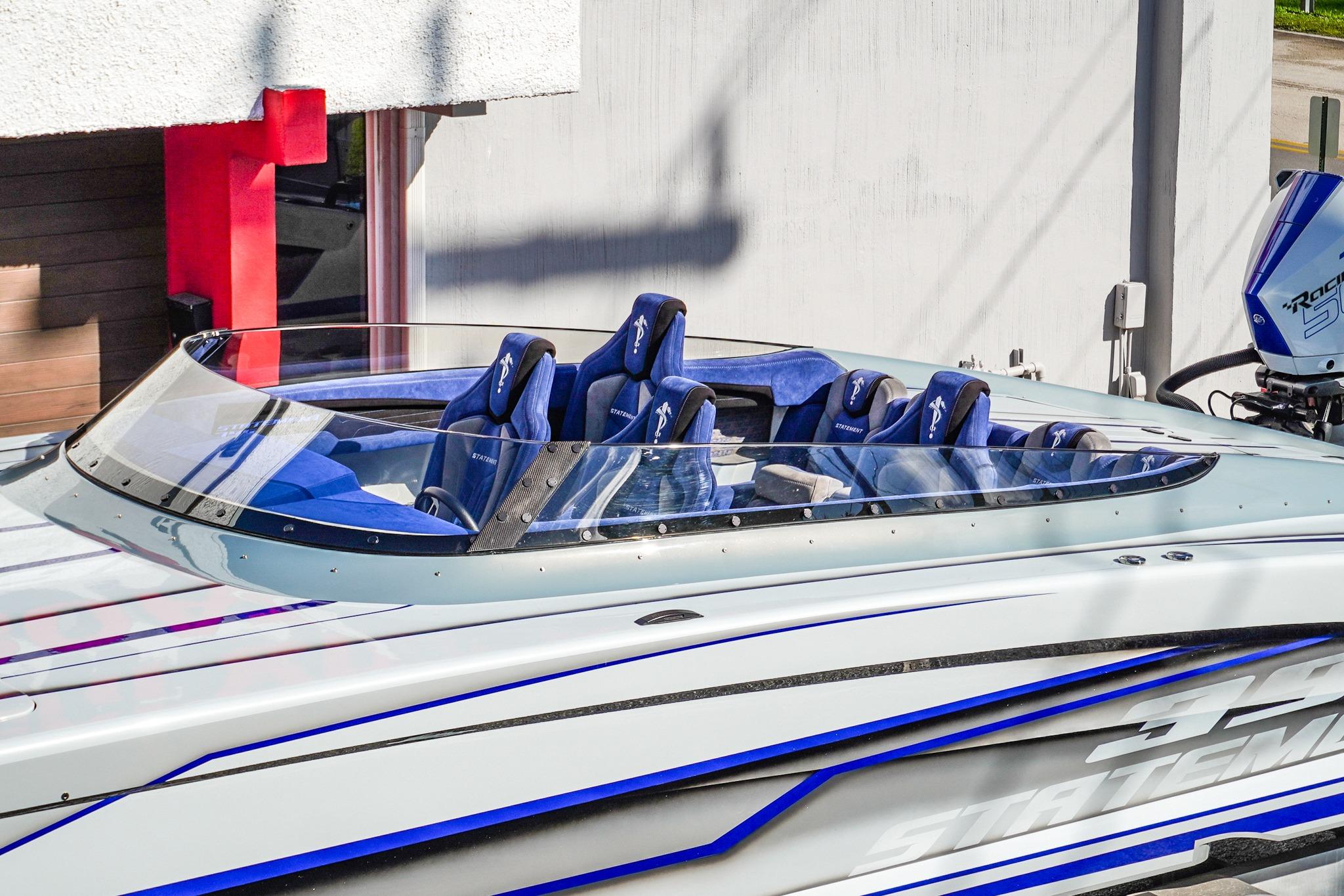 2026 Statement 396 speedboat with blue seats and sleek design.