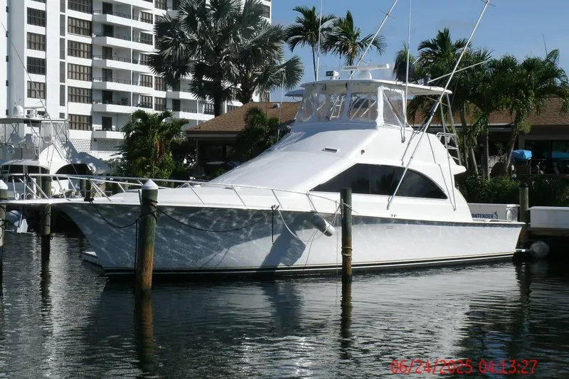  Yacht Photos Pics 1998 Ocean Yachts 48 Super Sport docked near palm trees and buildings.