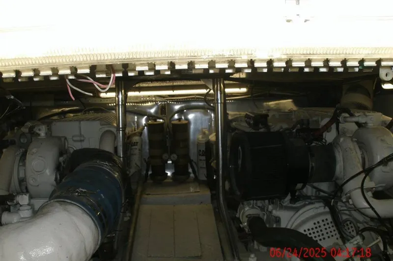  Yacht Photos Pics Engine room of 1998 Ocean Yachts 48 Super Sport, showcasing dual engines and mechanical components.
